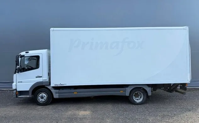 White box truck photographed from the side